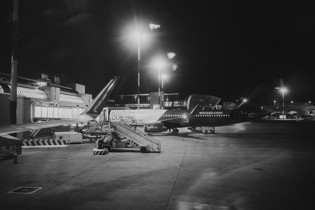 A black and white photo of an airport at night.
