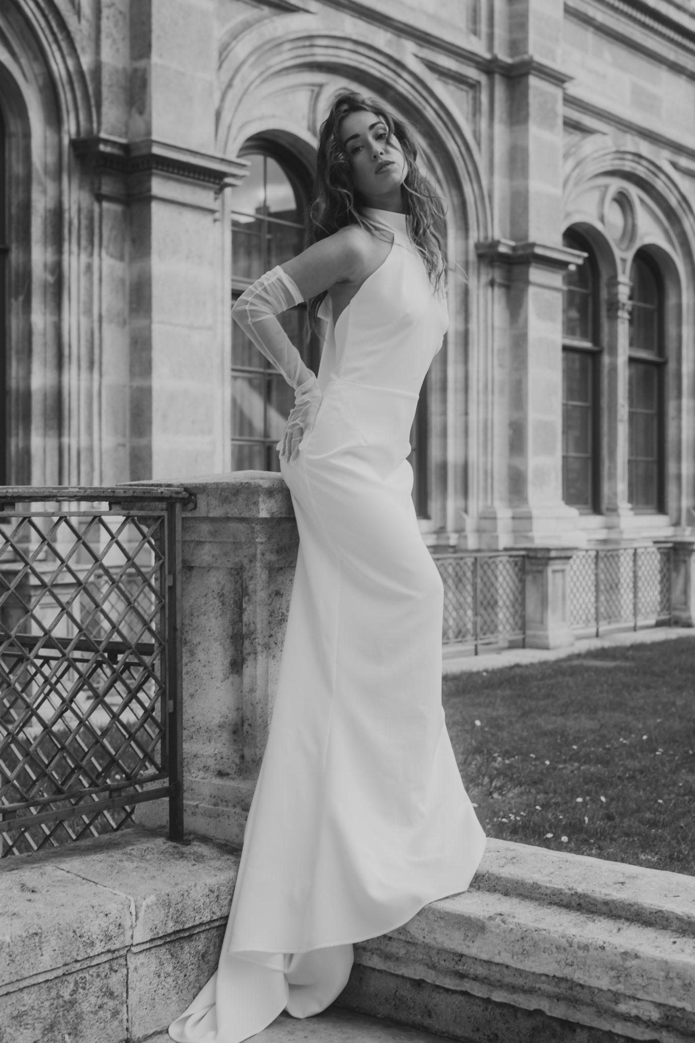 Editorial photo of a bride striking a pose in front of architecture in Vienna